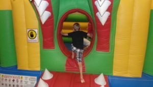 child climing into inflatable